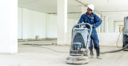 Hard at work on the parking lot at Imperial Mall & Apartments in Entebbe