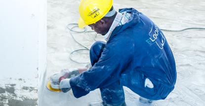 Hard at work on the parking lot at Imperial Mall & Apartments in Entebbe